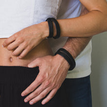Load image into Gallery viewer, Unisex handcrafted leather double wrap bracelet. The bracelet features a sleek, minimalist design with premium upcycled leather and a convenient magnetic clasp. Available in two sizes