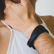 Load image into Gallery viewer, Unisex handcrafted leather double wrap bracelet. The bracelet features a sleek, minimalist design with premium upcycled leather and a convenient magnetic clasp. Available in two sizes