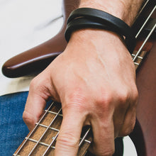 Load image into Gallery viewer, Unisex handcrafted leather double wrap bracelet. The bracelet features a sleek, minimalist design with premium upcycled leather and a convenient magnetic clasp. Available in two sizes