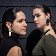 Load image into Gallery viewer, Striking black leather earrings with unique organic shapes, handcrafted from premium upcycled leather. Each pair combines smooth and textured surfaces for a visually contrasting design, ideal for adding a chic, eco-conscious touch to any outfit.