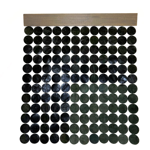 A wall hanging decor made with deep green leather, supple suede, and stained poplar wood. Ethically crafted and inherently stylish, it adds a luxurious touch to your space, creating captivating visual harmony. Its lightweight design ensures easy mounting, allowing you to curate a personalized aesthetic with ease.