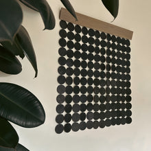 Load image into Gallery viewer, A wall hanging decor made with deep green leather, supple suede, and stained poplar wood. Ethically crafted and inherently stylish, it adds a luxurious touch to your space, creating captivating visual harmony. Its lightweight design ensures easy mounting, allowing you to curate a personalized aesthetic with ease.