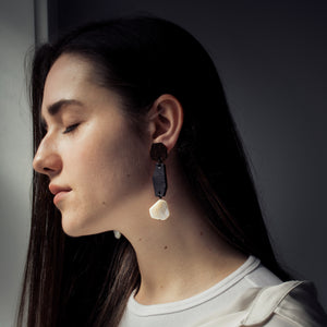 Handcrafted dangle earrings featuring geometric shapes, crafted from upcycled rich brown leather and soft suede, adorned with a pearly ivory shell bead at the bottom