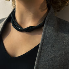 Load image into Gallery viewer, Three-layer elegant leather necklace featuring one strand of gleaming hematite beads and two strands of hand-cut black leather beads in varying sizes, emphasizing a sophisticated and mysterious appearance.