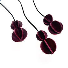 Load image into Gallery viewer, Set of six Christmas ornaments made from upcycled burgundy leather, featuring a trendy design and eco-friendly craftsmanship.