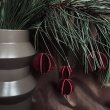 Load image into Gallery viewer, Set of six Christmas ornaments made from upcycled burgundy leather, featuring a trendy design and eco-friendly craftsmanship.