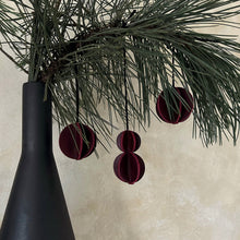 Load image into Gallery viewer, Set of six Christmas ornaments made from upcycled burgundy leather, featuring a trendy design and eco-friendly craftsmanship.