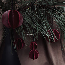 Load image into Gallery viewer, Set of six Christmas ornaments made from upcycled burgundy leather, featuring a trendy design and eco-friendly craftsmanship.