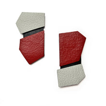 Load image into Gallery viewer, Modern, handcrafted leather earrings with bold angular shapes in a mix of red and off-white, highlighting their lightweight yet statement-making design.