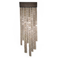 Load image into Gallery viewer, Minimalist wall hanging made of leather and wood, handcrafted and suspended, with freely hanging glossy leather strips catching light.