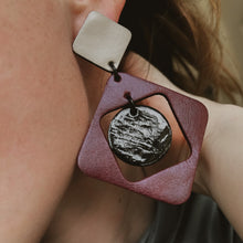 Load image into Gallery viewer, Upcycled leather dangle earring with glossy black center and layered square and circle shapes