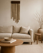 Load image into Gallery viewer, Minimalist wall hanging made of leather and wood, handcrafted and suspended, with freely hanging glossy leather strips in cosy modern interior.