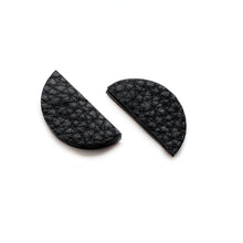 Load image into Gallery viewer, Upgrade your basic stud game with our leather studs that speak louder than words. These earrings add a touch of personality to any monochrome outfit and tie your look together phenomenally. The semicircle's bold yet simple shape, combined with the softest texture, exudes modern sophistication. The two pieces together represent wholeness, just like you. Don't miss out on these statement earrings that showcase your uniqueness. Shop now for a pair of earrings that complete your look