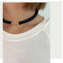 Load image into Gallery viewer, Hand-stitched with smooth leather tube on one side and textured leather sequins on the other. Featuring a vitreous lustre, clear quartz helps to declutter the mind, body, and spirit to create clarity and focus around a desire, allowing you to amplify your inner power and live, laugh, and love to your fullest potential. Made by WAIWAI, this choker is the softest, lightest, and most comfortable you will ever wear, with absolutely no resistance against your neck.
