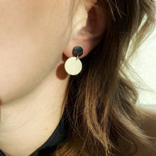 Load image into Gallery viewer, Effortlessly chic minimalist earrings in earthy tones. Basic shapes & delicate leather grain add subtle character. Suspended circles symbolize wholeness & promote a state of calm. Perfect for modernizing any outfit.