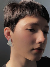 Load image into Gallery viewer, Our leather triangle earrings represent balance and power. The opulent leather adds a bold touch to your outfit. Wear them for a magical boost. Shop now and embrace sharp angles.