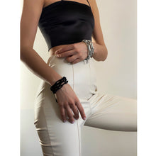Load image into Gallery viewer, Elevate your jewelry collection with this unique hand-stitched leather chain from WAIWAI. The innovative design features leather links of different lengths and strategically-placed clasps, allowing for multiple styling options. The soft texture and visible grain of the high-quality leather make for a luxurious and comfortable wear. Lightweight and versatile, this chain adds a powerful sense of connectedness to any outfit.