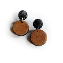 Load image into Gallery viewer, Effortlessly chic minimalist earrings in earthy tones. Basic shapes & delicate leather grain add subtle character. Suspended circles symbolize wholeness & promote a state of calm. Perfect for modernizing any outfit.
