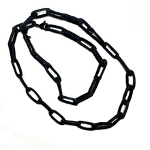 Load image into Gallery viewer, Elevate your jewelry collection with this unique hand-stitched leather chain from WAIWAI. The innovative design features leather links of different lengths and strategically-placed clasps, allowing for multiple styling options. The soft texture and visible grain of the high-quality leather make for a luxurious and comfortable wear. Lightweight and versatile, this chain adds a powerful sense of connectedness to any outfit.