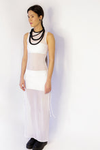 Load image into Gallery viewer, Elevate your style with our bold and modern extra-long necklace. Crafted with genuine leather disks ranging from 6-14mm and cotton waxed cord, it's a true statement piece that challenges the ideals of traditional accessories. Wear it as is or get creative by draping it around your waist or creating a crossed pattern. This disruptor of a necklace is sure to turn heads and start conversations. Shop now for a minimalistic yet eye-catching addition to your high-fashion wardrobe.