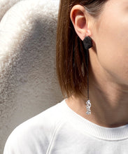 Load image into Gallery viewer, Add a touch of modern elegance to your wardrobe with our unique drop earrings. Crafted with clear quartz and featuring asymmetrical geometry, these earrings are perfect for fashion-forward women who appreciate design and art. The streamlined simplicity of our earrings will make you feel elegant and statuesque, while the lightweight design ensures all-day comfort. Shop now for a statement piece that promotes clarity and focus in the mind, body, and spirit