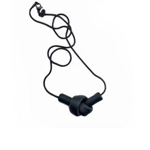 Load image into Gallery viewer, Elevate your style with a leather knot pendant necklace - a symbol of eternal connection and cherished bonds. With modern sophistication and impeccable hand craftsmanship, this necklace showcases the fine qualities of leather. Available in two lengths, it's functional art with a meaning, making it the perfect gift for yourself or a loved one. Choose the shorter length for a flattering collarbone accent or the longer length to wear over your heart.