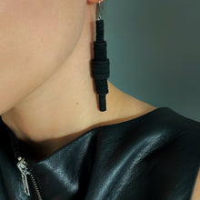 Load image into Gallery viewer, Revamp your classic dangle earrings with a modern minimalist twist. Our one-of-a-kind design features stacked sequins that create a bold yet muted impact. Enjoy the supreme softness and lightweight feel of these earrings as you move freely in their swing. The lengthening effect adds dimension and flatters your face. Don't miss out on this unique statement piece. Shop now for a pair of earrings that combine elegance with contemporary design.