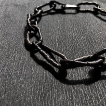Load image into Gallery viewer, The contemporary design features flexible links that can be molded to create a serene or expressive look, adding a hint of deviance to a classic piece. The luxurious leather-wrapped links make it timeless and forever relevant. Chains symbolize our connections to others, the earth, and ourselves, making this necklace not only fashionable but also meaningful. Get creative with your styling and showcase the attractive closure. Don&#39;t miss out on this must-have accessory.
