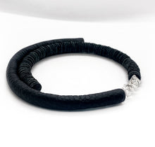 Load image into Gallery viewer, Hand-stitched with smooth leather tube on one side and textured leather sequins on the other. Featuring a vitreous lustre, clear quartz helps to declutter the mind, body, and spirit to create clarity and focus around a desire, allowing you to amplify your inner power and live, laugh, and love to your fullest potential. Made by WAIWAI, this choker is the softest, lightest, and most comfortable you will ever wear, with absolutely no resistance against your neck.