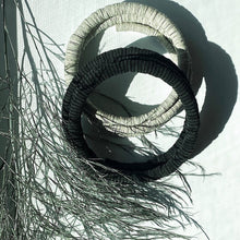 Load image into Gallery viewer, Discover the perfect blend of bold simplicity and high texture with WAIWAI's softest choker. The intriguing design of this helical choker symbolizes growth, evolution, and resilience. It flexes easily for comfortable wear, and its clasp-free design ensures clean lines from every angle. Experience the serpentine embrace of this choker's softness against your skin and forget it's even there. Elevate your jewelry collection with WAIWAI's unique and comfortable choker.