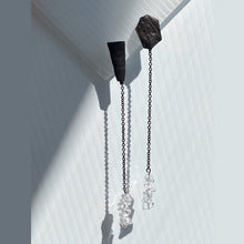 Load image into Gallery viewer, Add a touch of modern elegance to your wardrobe with our unique drop earrings. Crafted with clear quartz and featuring asymmetrical geometry, these earrings are perfect for fashion-forward women who appreciate design and art. The streamlined simplicity of our earrings will make you feel elegant and statuesque, while the lightweight design ensures all-day comfort. Shop now for a statement piece that promotes clarity and focus in the mind, body, and spirit