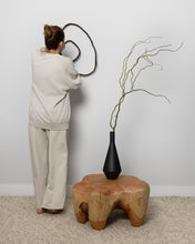 Load image into Gallery viewer, Made from upcycled leather, this unique wall decor piece allows you to unleash your creativity and design a personalized look for your home. Its flexibility enables you to adjust it to match your interior design and mood, giving you the freedom to experiment with different shapes and arrangements. With no hooks or fixtures required, installation is easy and hassle-free. Lightweight and easy to care for, this piece is sure to be an eye-catching focal point in any room.