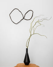 Load image into Gallery viewer, Made from upcycled leather, this unique wall decor piece allows you to unleash your creativity and design a personalized look for your home. Its flexibility enables you to adjust it to match your interior design and mood, giving you the freedom to experiment with different shapes and arrangements. With no hooks or fixtures required, installation is easy and hassle-free. Lightweight and easy to care for, this piece is sure to be an eye-catching focal point in any room.