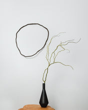 Load image into Gallery viewer, Made from upcycled leather, this unique wall decor piece allows you to unleash your creativity and design a personalized look for your home. Its flexibility enables you to adjust it to match your interior design and mood, giving you the freedom to experiment with different shapes and arrangements. With no hooks or fixtures required, installation is easy and hassle-free. Lightweight and easy to care for, this piece is sure to be an eye-catching focal point in any room.