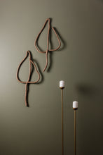 Load image into Gallery viewer, Handmade upcycled leather wall decor accent in the shape of a leaf, featuring a minimalist design with natural textures. Soft, lightweight and eco-friendly, this elegant piece adds a touch of sophistication to any room. Perfect for those who appreciate high-end design, it is an affordable luxury item that is easy to hang on any wall. A sustainable choice that showcases your commitment to eco-conscious living.
