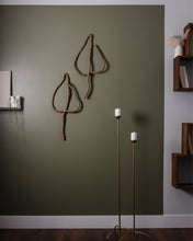 Load image into Gallery viewer, Handmade upcycled leather wall decor accent in the shape of a leaf, featuring a minimalist design with natural textures. Soft, lightweight and eco-friendly, this elegant piece adds a touch of sophistication to any room. Perfect for those who appreciate high-end design, it is an affordable luxury item that is easy to hang on any wall. A sustainable choice that showcases your commitment to eco-conscious living.