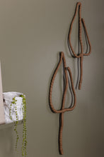 Load image into Gallery viewer, Handmade upcycled leather wall decor accent in the shape of a leaf, featuring a minimalist design with natural textures. Soft, lightweight and eco-friendly, this elegant piece adds a touch of sophistication to any room. Perfect for those who appreciate high-end design, it is an affordable luxury item that is easy to hang on any wall. A sustainable choice that showcases your commitment to eco-conscious living.