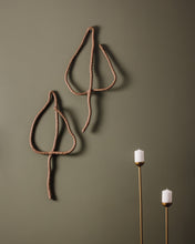 Load image into Gallery viewer, Handmade upcycled leather wall decor accent in the shape of a leaf, featuring a minimalist design with natural textures. Soft, lightweight and eco-friendly, this elegant piece adds a touch of sophistication to any room. Perfect for those who appreciate high-end design, it is an affordable luxury item that is easy to hang on any wall. A sustainable choice that showcases your commitment to eco-conscious living.