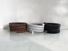Load image into Gallery viewer, WAIWAI modern ethically handcrafted leather wide cuff black bracelet, minimal design, soft, lightweight and comfortable sustainable leather jewelry, reclaimed leather wrist bracelet, contemporary design, handmade in Vancouver, Bc, Canada