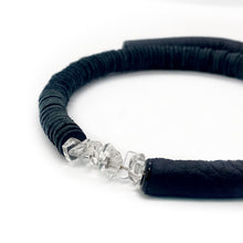 Load image into Gallery viewer, Hand-stitched with smooth leather tube on one side and textured leather sequins on the other. Featuring a vitreous lustre, clear quartz helps to declutter the mind, body, and spirit to create clarity and focus around a desire, allowing you to amplify your inner power and live, laugh, and love to your fullest potential. Made by WAIWAI, this choker is the softest, lightest, and most comfortable you will ever wear, with absolutely no resistance against your neck.