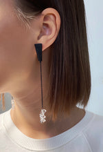 Load image into Gallery viewer, Add a touch of modern elegance to your wardrobe with our unique drop earrings. Crafted with clear quartz and featuring asymmetrical geometry, these earrings are perfect for fashion-forward women who appreciate design and art. The streamlined simplicity of our earrings will make you feel elegant and statuesque, while the lightweight design ensures all-day comfort. Shop now for a statement piece that promotes clarity and focus in the mind, body, and spirit