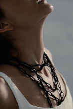 Load image into Gallery viewer, Elevate your jewelry collection with this unique hand-stitched leather chain from WAIWAI. The innovative design features leather links of different lengths and strategically-placed clasps, allowing for multiple styling options. The soft texture and visible grain of the high-quality leather make for a luxurious and comfortable wear. Lightweight and versatile, this chain adds a powerful sense of connectedness to any outfit.