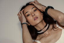 Load image into Gallery viewer, Our hand-stitched white leather choker with clear quartz crystals exudes both tranquility and edge. Adorn any outfit for a refined appearance or to give intention to your look. WAIWAI chokers are the softest, lightest, and most comfortable you'll ever wear. Shop now and elevate your look with comfort and style.