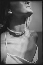 Load image into Gallery viewer, Our hand-stitched white leather choker with pyrite crystals embodies empowerment anchored by serenity. Pyrite deflects negative energy and promotes physical healing and mental strength. Complement any outfit with this choker that is soft, comfortable, and easy to wear. Shop now and feel empowered both inside and out.