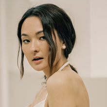 Load image into Gallery viewer, Uncomplicated and effortless, our leather stud earrings are a modern classic. Texture, softness, and sophistication in a tiny package. Appreciate the small things and enhance any outfit. Shop now and elevate your style with simplicity.