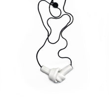 Load image into Gallery viewer, Elevate your style with a leather knot pendant necklace - a symbol of eternal connection and cherished bonds. With modern sophistication and impeccable hand craftsmanship, this necklace showcases the fine qualities of leather. Available in two lengths, it's functional art with a meaning, making it the perfect gift for yourself or a loved one. Choose the shorter length for a flattering collarbone accent or the longer length to wear over your heart.
