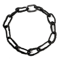 Load image into Gallery viewer, The contemporary design features flexible links that can be molded to create a serene or expressive look, adding a hint of deviance to a classic piece. The luxurious leather-wrapped links make it timeless and forever relevant. Chains symbolize our connections to others, the earth, and ourselves, making this necklace not only fashionable but also meaningful. Get creative with your styling and showcase the attractive closure. Don't miss out on this must-have accessory.