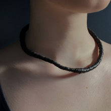 Load image into Gallery viewer, This genuine leather choker/bracelet hybrid lets you express your individuality and set your own standards of fashion. Wear it as a statement piece around your neck or wrist, or create customizable patterns for a unique look every time. Meticulously crafted with genuine leather wrapped around metal wire, this daring accessory is built to last. Be bold, be different, and let the Rebel Coil take your style to the next level.