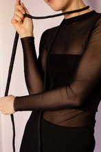 Load image into Gallery viewer, Elevate your style with our bold and modern extra-long necklace. Crafted with genuine leather disks ranging from 6-14mm and cotton waxed cord, it's a true statement piece that challenges the ideals of traditional accessories. Wear it as is or get creative by draping it around your waist or creating a crossed pattern. This disruptor of a necklace is sure to turn heads and start conversations. Shop now for a minimalistic yet eye-catching addition to your high-fashion wardrobe.