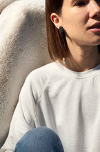 Load image into Gallery viewer, Add a touch of modern elegance to your wardrobe with our unique drop earrings. Crafted with clear quartz and featuring asymmetrical geometry, these earrings are perfect for fashion-forward women who appreciate design and art. The streamlined simplicity of our earrings will make you feel elegant and statuesque, while the lightweight design ensures all-day comfort. Shop now for a statement piece that promotes clarity and focus in the mind, body, and spirit